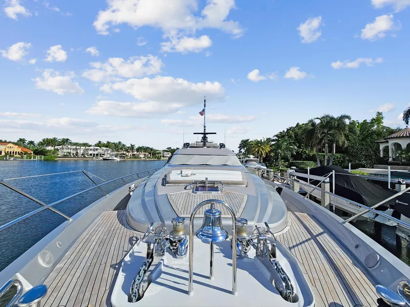 Slide: The Image of 2008 Palmer Johnson 120 Sports Cruiser yacht docked by waterfront homes. - 10
