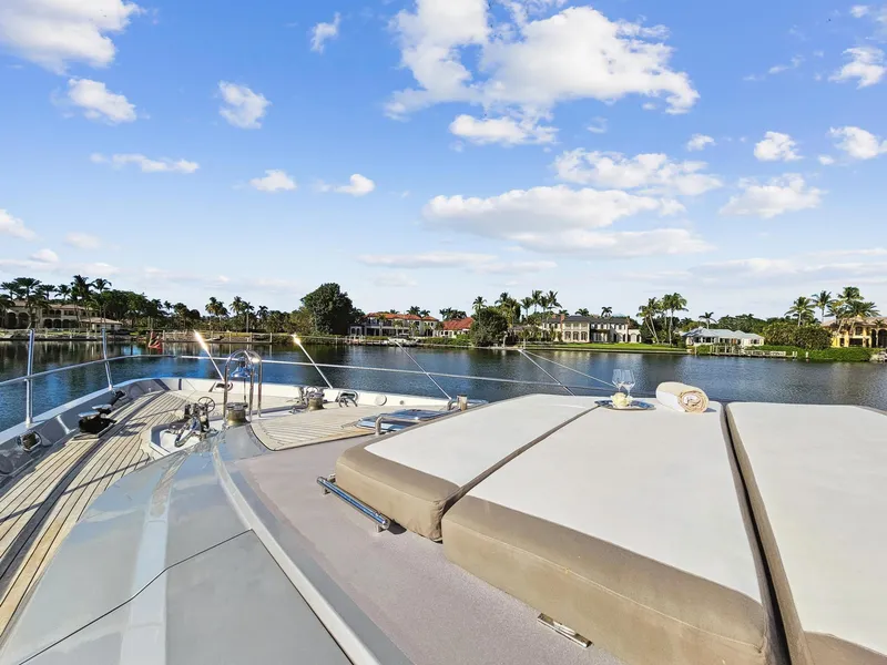 Slide: The Image of Palmer Johnson 120 Sports Cruiser 2008 yacht deck with scenic waterfront view. - 12