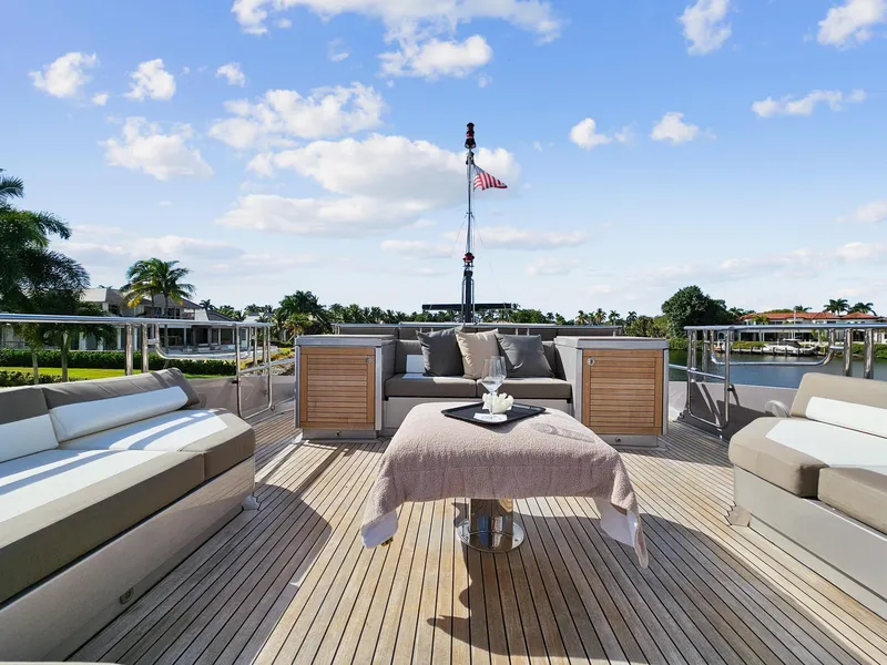 Slide: The Image of Luxurious deck of 2008 Palmer Johnson 120 Sports Cruiser with elegant seating and table. - 14