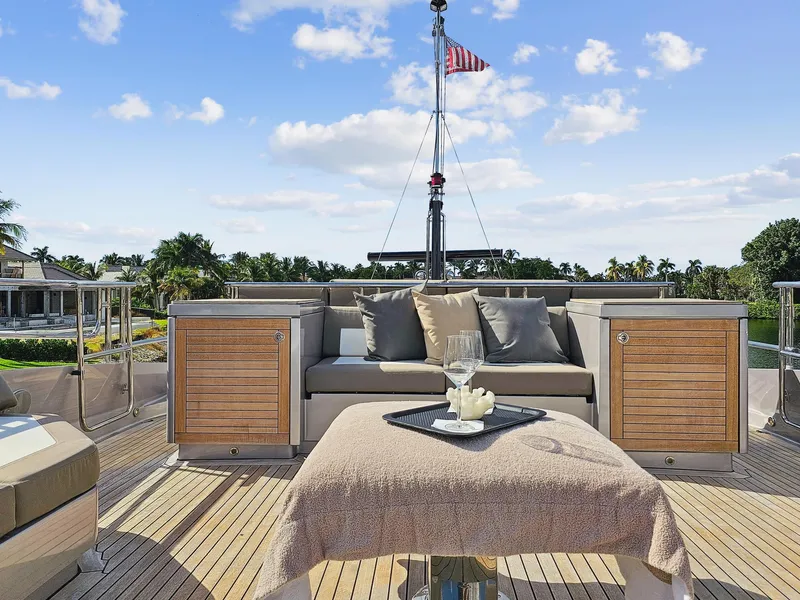 Slide: The Image of Luxury deck of 2008 Palmer Johnson 120 Sports Cruiser with seating and table. - 15