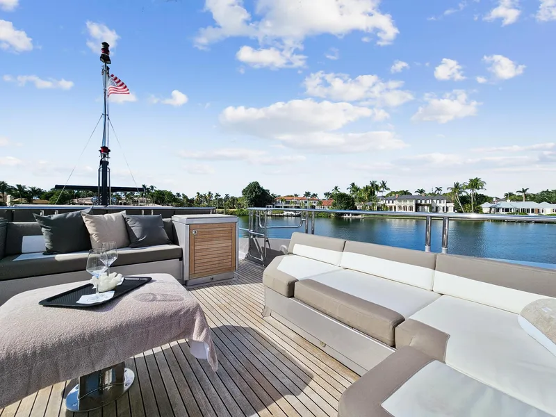 Slide: The Image of Luxurious deck of 2008 Palmer Johnson 120 Sports Cruiser with waterfront view. - 16