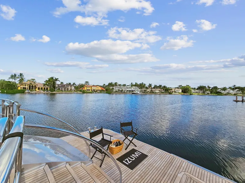 Slide: The Image of Luxury view from Palmer Johnson 120 Sports Cruiser (2008) deck, overlooking serene waterfront homes. - 22