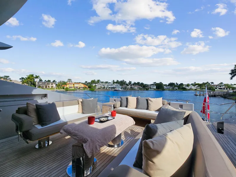 Slide: The Image of Luxurious deck of 2008 Palmer Johnson 120 Sports Cruiser with waterfront view. - 24