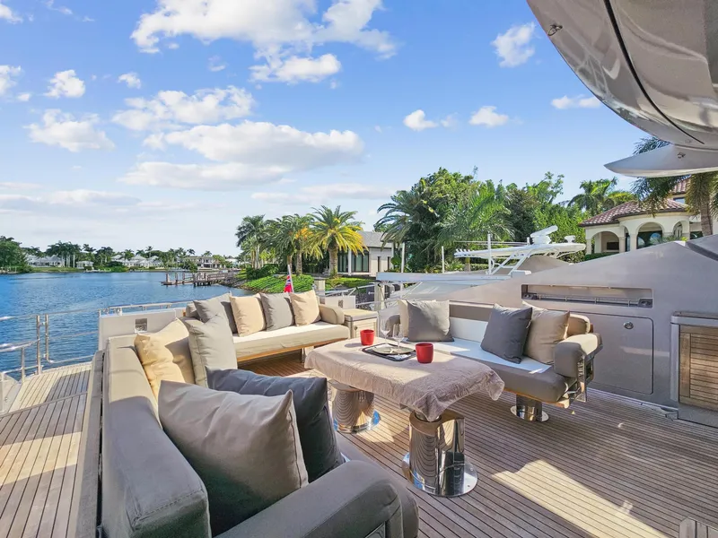 Slide: The Image of Luxurious deck of 2008 Palmer Johnson 120 Sports Cruiser yacht with plush seating and scenic waterfront view. - 26