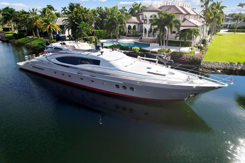 Slide: The Image of 2008 Palmer Johnson 120 Sports Cruiser yacht docked near a luxurious waterfront mansion. - 3