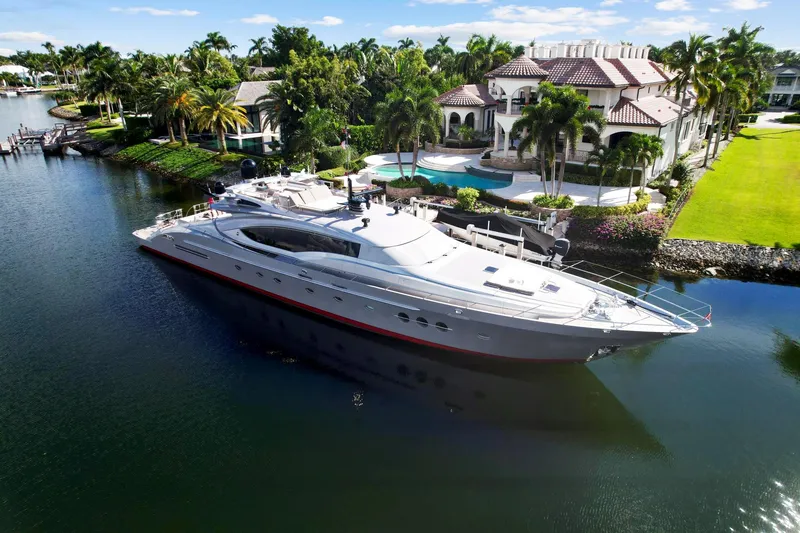 Slide: The Image of Palmer Johnson 120 Sports Cruiser 2008 yacht docked near luxury waterfront mansion. - 4