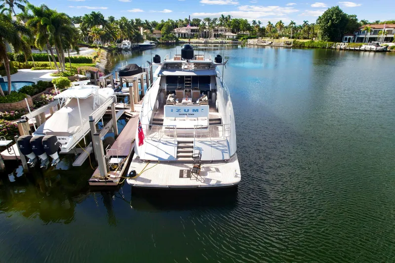 Slide: The Image of 2008 Palmer Johnson 120 Sports Cruiser docked in a scenic marina. - 8