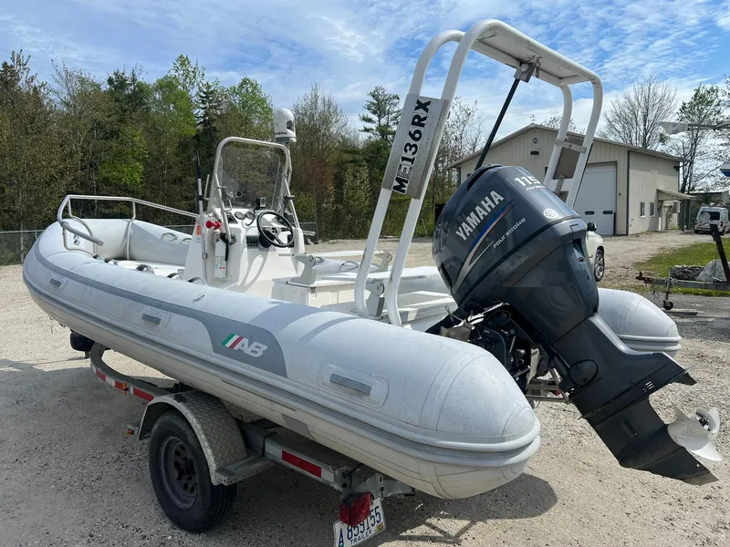 Slide: The Image of 2004 AB 570 VST inflatable boat with Yamaha outboard motor on trailer. - 1
