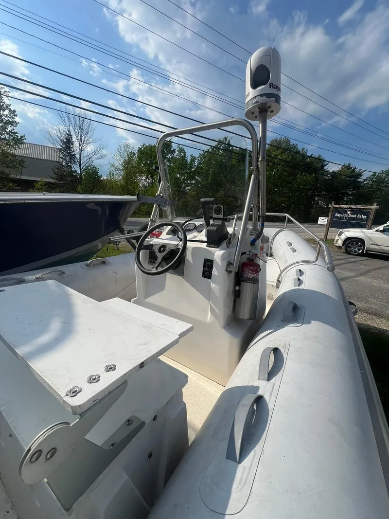 Slide: The Image of 2004 AB 570 VST inflatable boat with steering console and navigation equipment. - 6