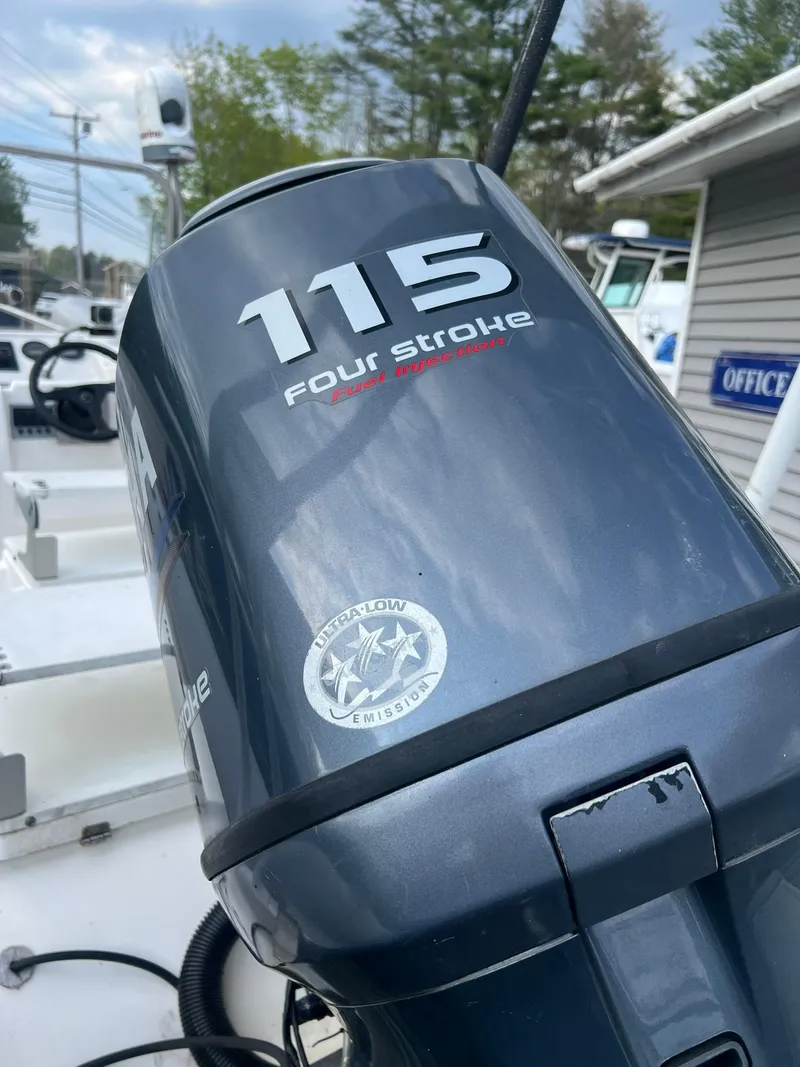 Slide: The Image of Close-up of a 115 Four Stroke outboard motor on a 2004 AB 570 VST boat. - 7
