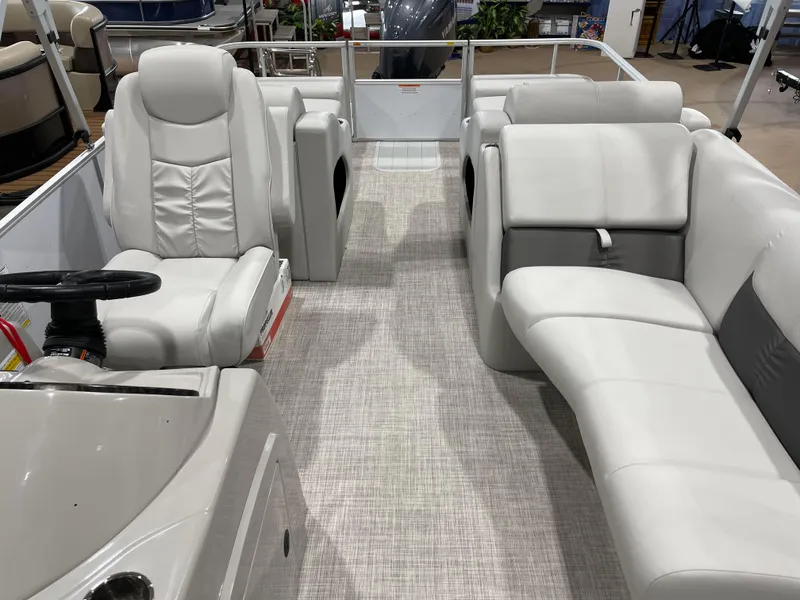 Slide: The Image of 2024 SunCatcher Fusion 324SS interior with plush seating and modern design. - 14