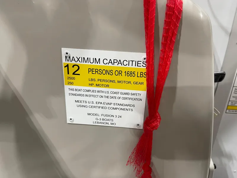 Slide: The Image of 2024 SunCatcher Fusion 324SS maximum capacities label, 12 persons or 1685 lbs. - 18