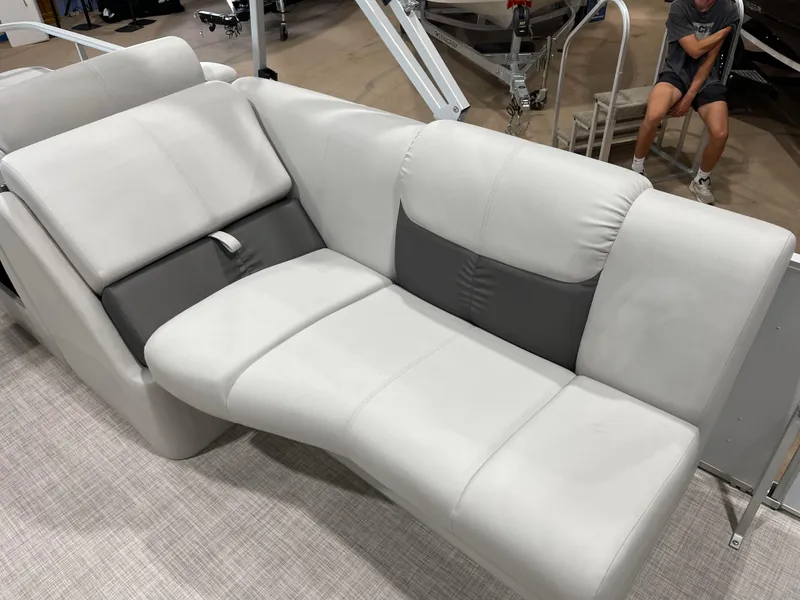 Slide: The Image of 2024 SunCatcher Fusion 324SS boat interior with luxurious white and gray seating. - 19