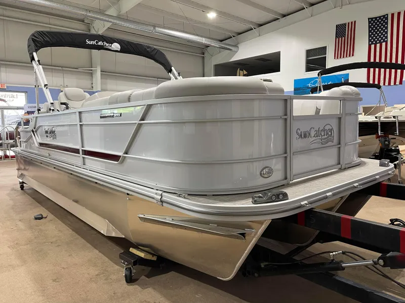 Slide: The Image of 2024 SunCatcher Fusion 324SS pontoon boat in showroom. - 2