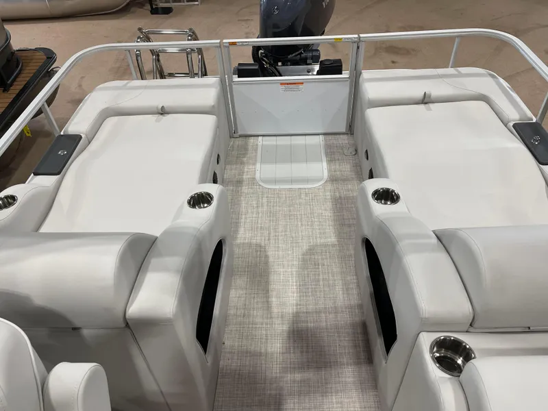 Slide: The Image of 2024 SunCatcher Fusion 324SS boat interior with white seating and cup holders. - 20