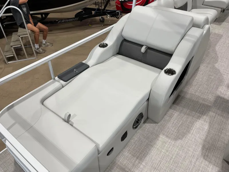 Slide: The Image of 2024 SunCatcher Fusion 324SS boat lounge seat with cup holders and armrests. - 22