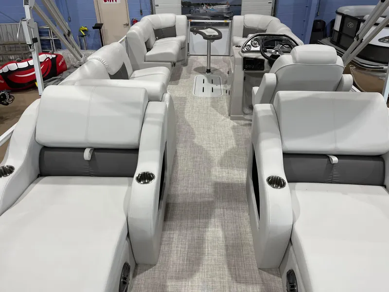 Slide: The Image of 2024 SunCatcher Fusion 324SS pontoon boat interior with luxurious seating and modern helm. - 23