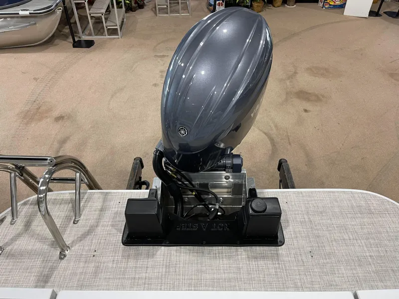 Slide: The Image of 2024 SunCatcher Fusion 324SS outboard motor in showroom. - 24