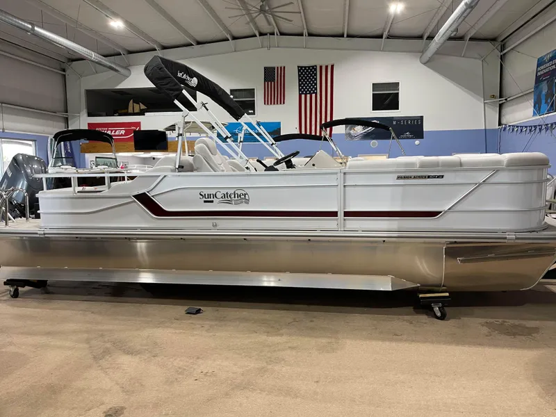 Slide: The Image of 2024 SunCatcher Fusion 324SS pontoon boat in showroom. - 3