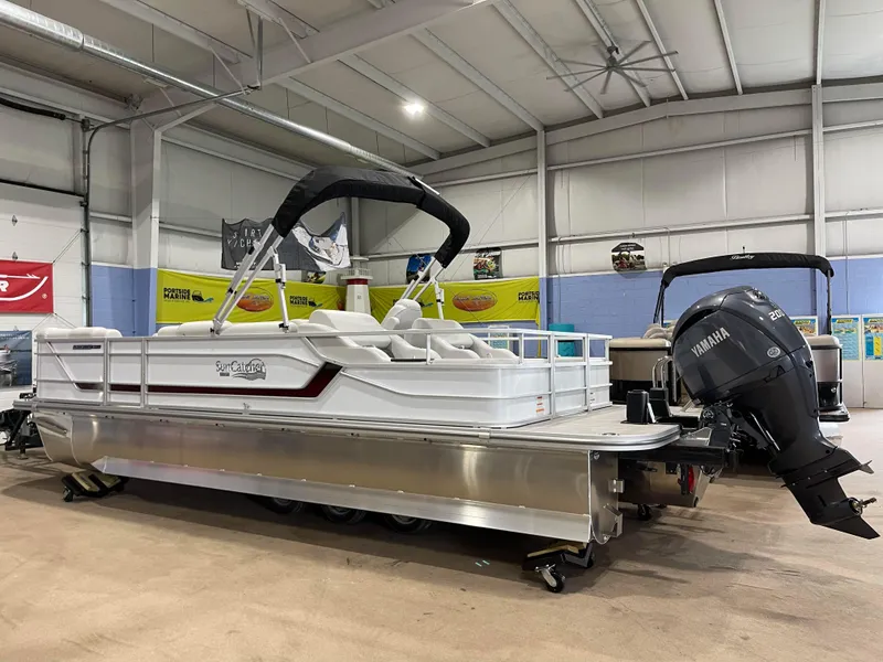 Slide: The Image of 2024 SunCatcher Fusion 324SS pontoon boat in showroom with Yamaha outboard motor. - 8