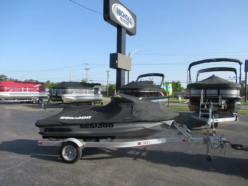 Slide: The Image of 2018 Bombardier SeaDoo GTX 230 Li on trailer, covered, at dealership. - 4