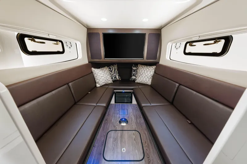 Slide: The Image of Luxurious interior of 2018 Scout 380 LXF boat with leather seating and TV. - 37
