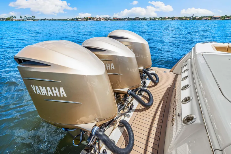 Slide: The Image of 2018 Scout 380 LXF with triple Yamaha outboard engines on the water. - 41