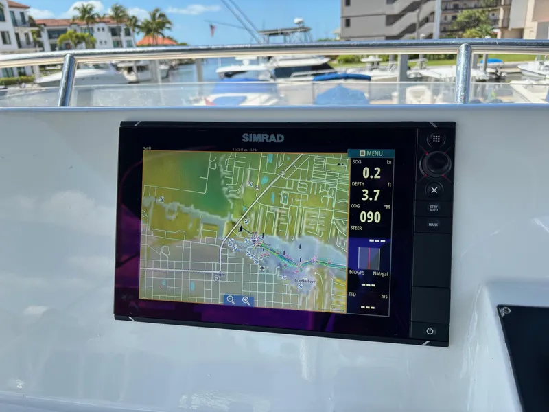Slide: The Image of Simrad navigation system on 2004 Sabreline 36 Sedan yacht, docked in a marina. - 13