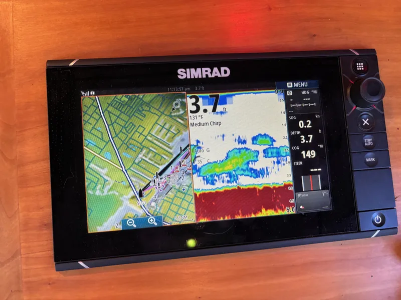 Slide: The Image of Simrad navigation and sonar display on a 2004 Sabreline 36 Sedan boat. - 33