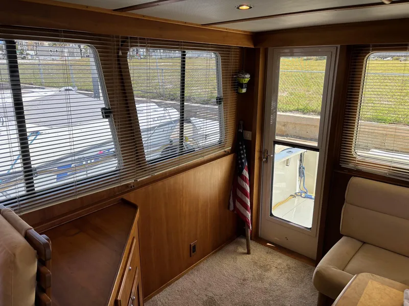 Slide: The Image of Interior of 2004 Sabreline 36 Sedan with windows, door, and American flag. - 37