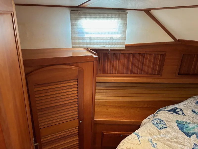 Slide: The Image of 2004 Sabreline 36 Sedan cabin interior with wooden cabinetry and bed. - 49