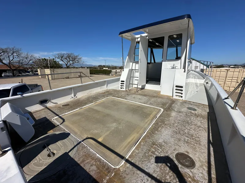 Slide: The Image of 1992 Custom Hueneme Boat Works vessel with spacious deck and cabin. - 11