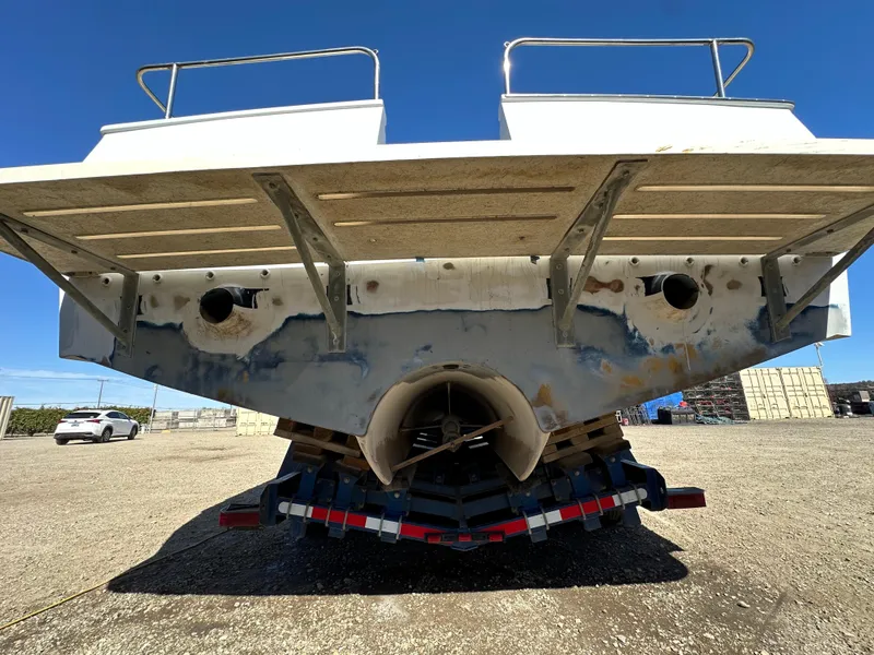 Slide: The Image of Rear view of a 1992 Custom Hueneme Boat Works vessel on a trailer. - 12