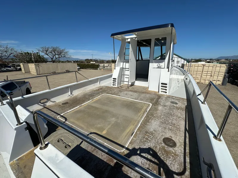 Slide: The Image of 1992 Custom Hueneme Boat Works vessel with spacious deck and cabin, docked outdoors. - 15