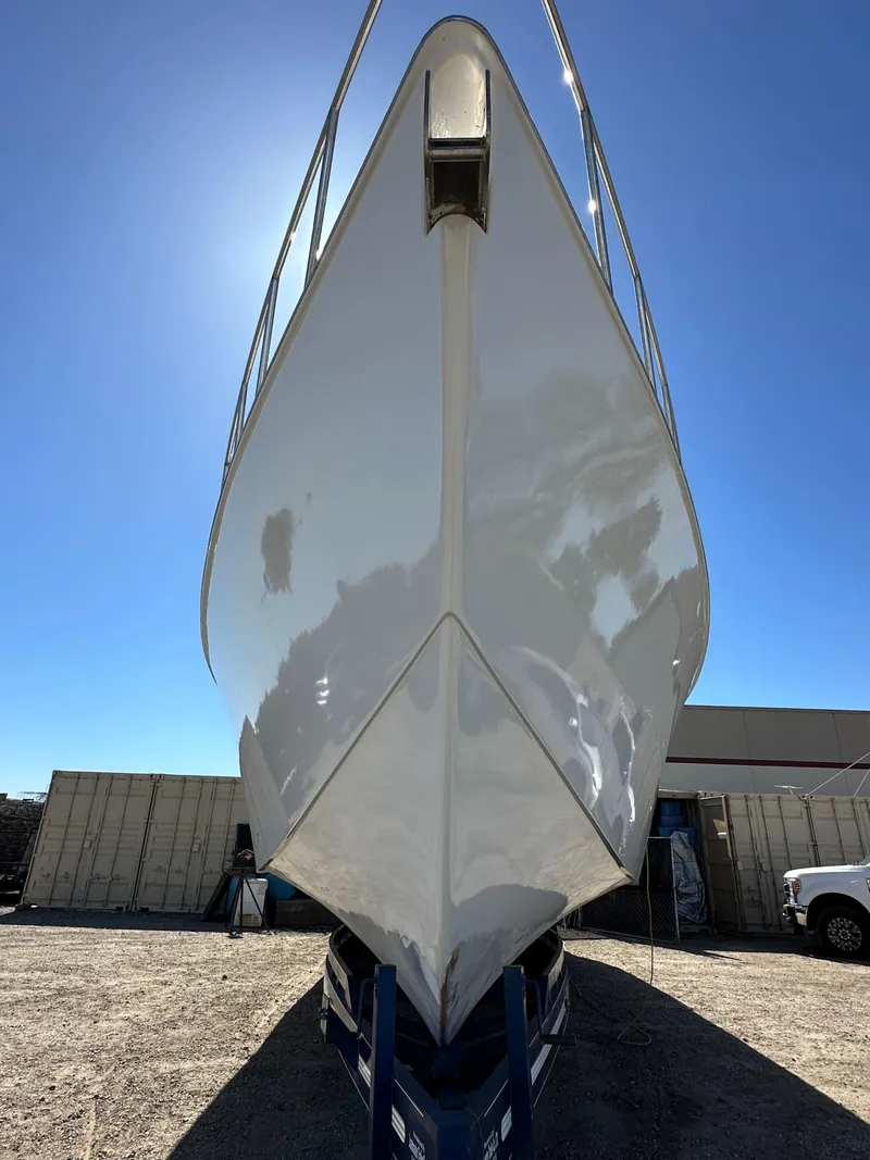 Slide: The Image of Alt text: 1992 Custom Hueneme Boat Works vessel on dry dock under clear blue sky. - 3