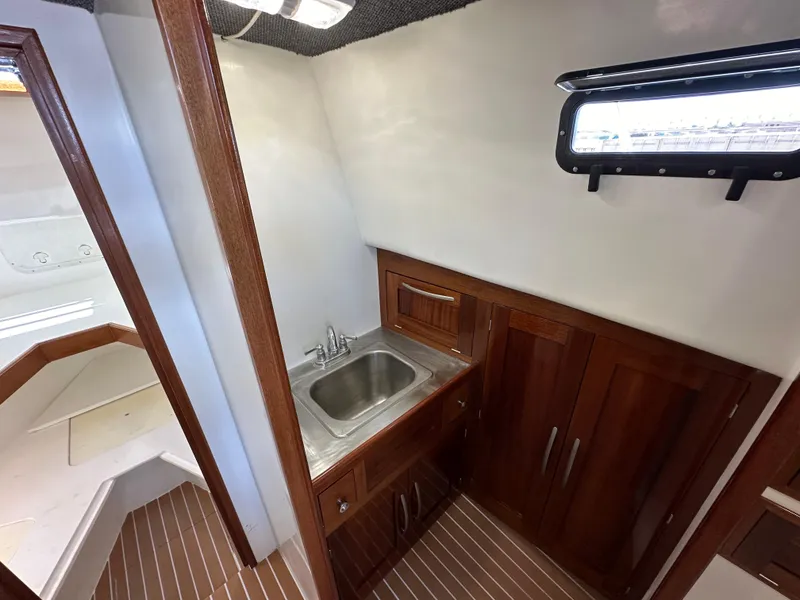 Slide: The Image of 1992 Custom Hueneme Boat Works interior with sink and wooden cabinetry. - 31