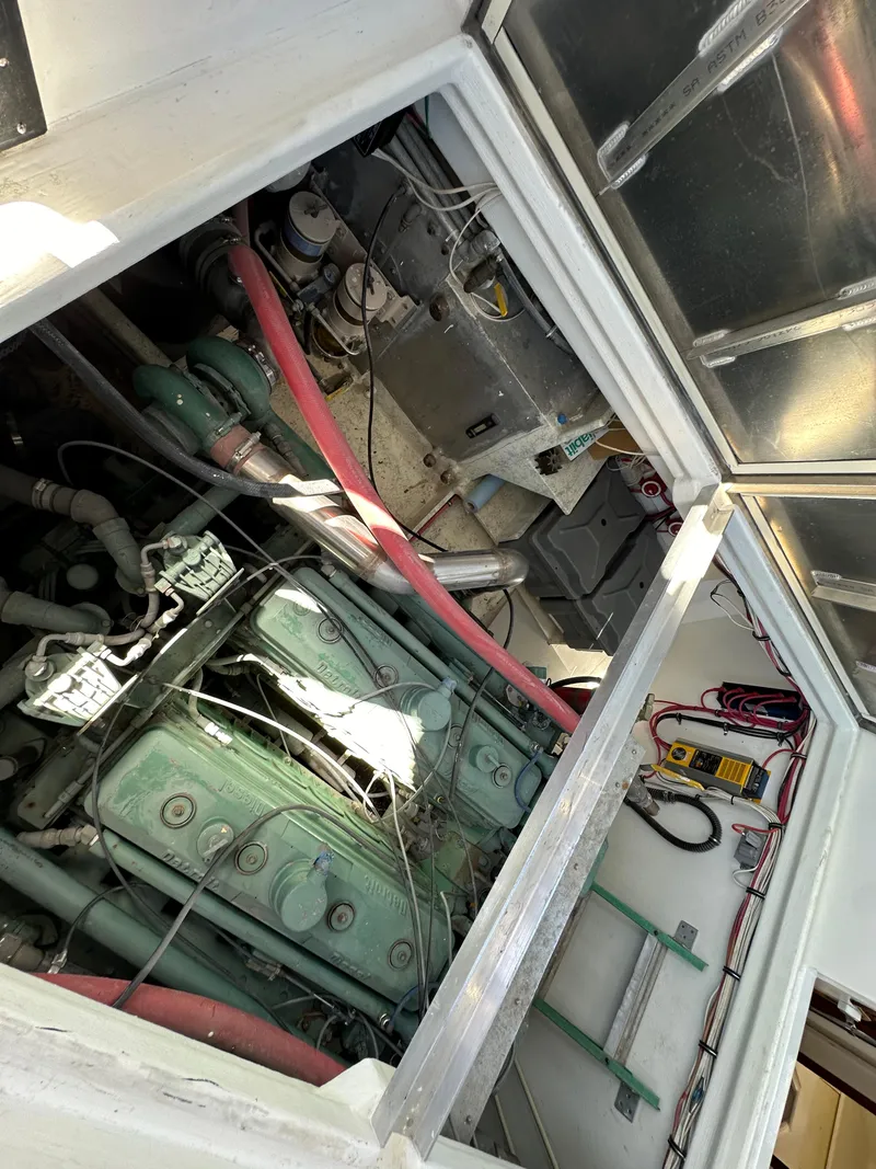Slide: The Image of Engine compartment of a 1992 Custom Hueneme Boat Works vessel with visible machinery and wiring. - 37