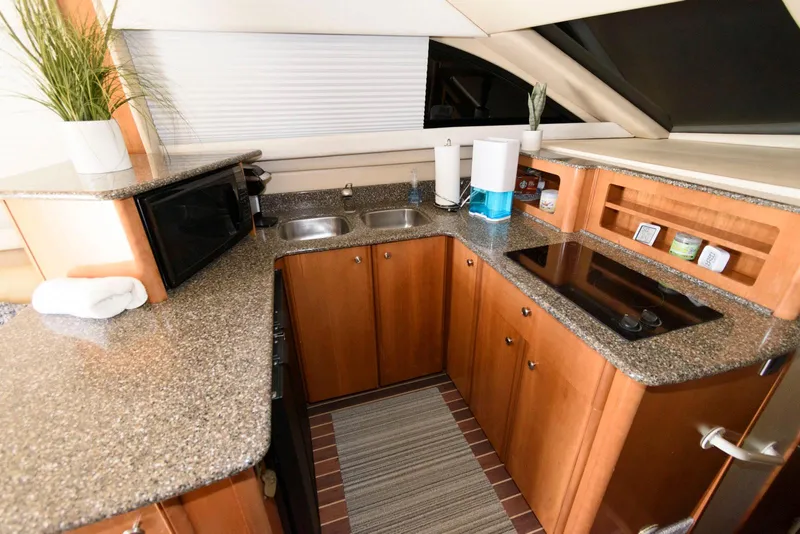 Slide: The Image of Luxurious kitchen interior of 2003 Meridian 381 Sedan yacht with modern appliances. - 12