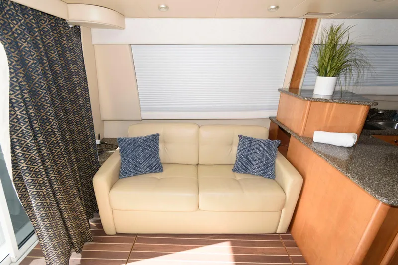 Slide: The Image of Luxurious interior of 2003 Meridian 381 Sedan with beige sofa and blue cushions. - 15