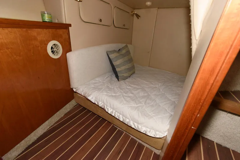 Slide: The Image of Cozy cabin interior of 2003 Meridian 381 Sedan with bed and wooden accents. - 17