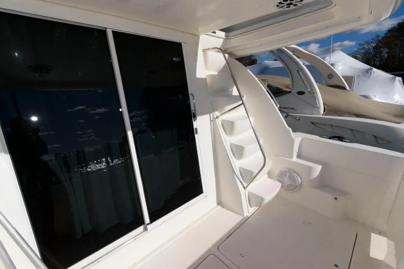 Slide: The Image of 2003 Meridian 381 Sedan yacht interior with stairs and sliding glass door. - 4