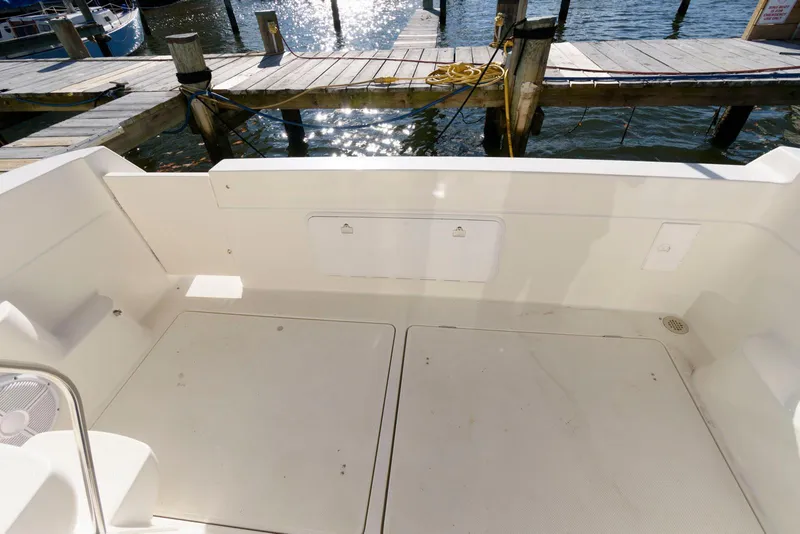 Slide: The Image of 2003 Meridian 381 Sedan boat deck with dock view. - 5
