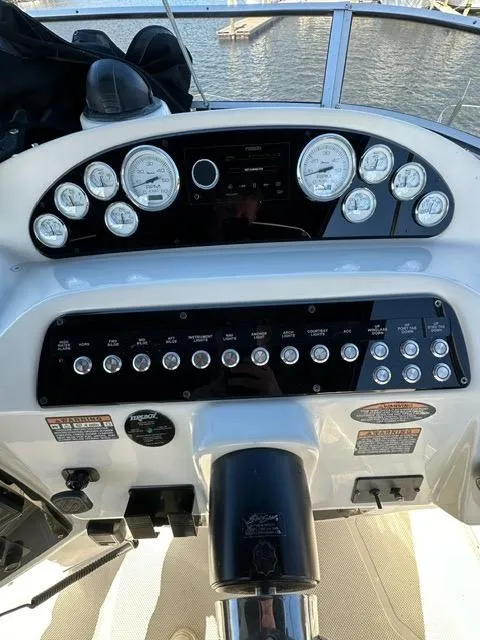 Slide: The Image of 2003 Meridian 381 Sedan boat dashboard with gauges and controls. - 6