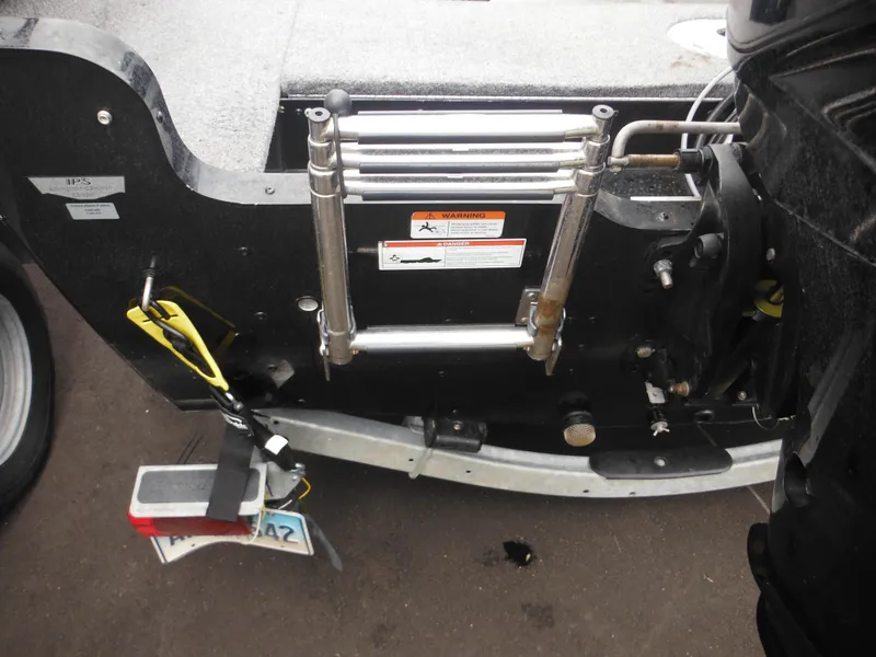 Slide: The Image of 2018 Lund 1625 Fury XL SS boat with rear ladder and trailer attachment. - 23