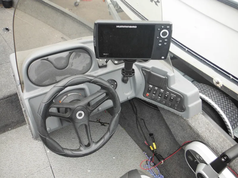 Slide: The Image of 2018 Lund 1625 Fury XL SS boat dashboard with Humminbird fish finder. - 26