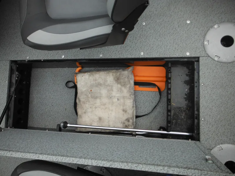 Slide: The Image of 2018 Lund 1625 Fury XL SS boat storage compartment with life jackets and seat cushion. - 30