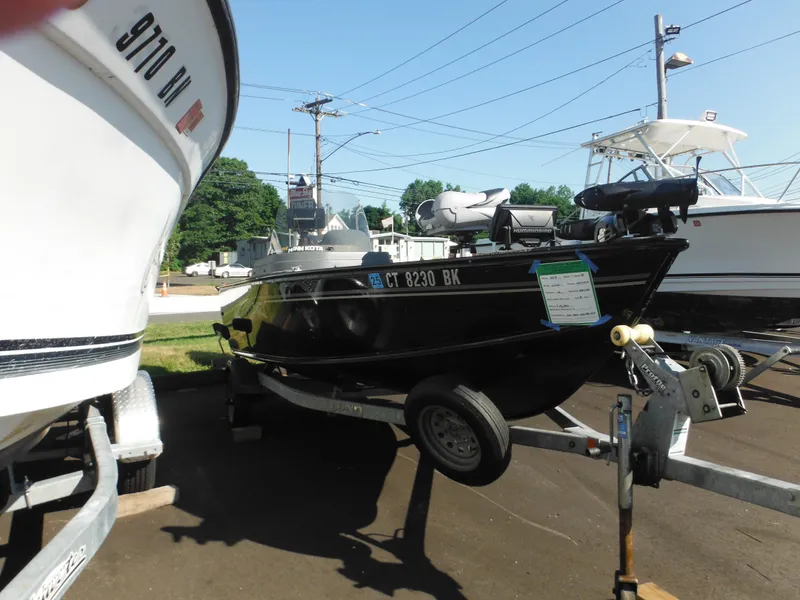 Slide: The Image of 2018 Lund 1625 Fury XL SS boat on a trailer in a parking lot. - 41