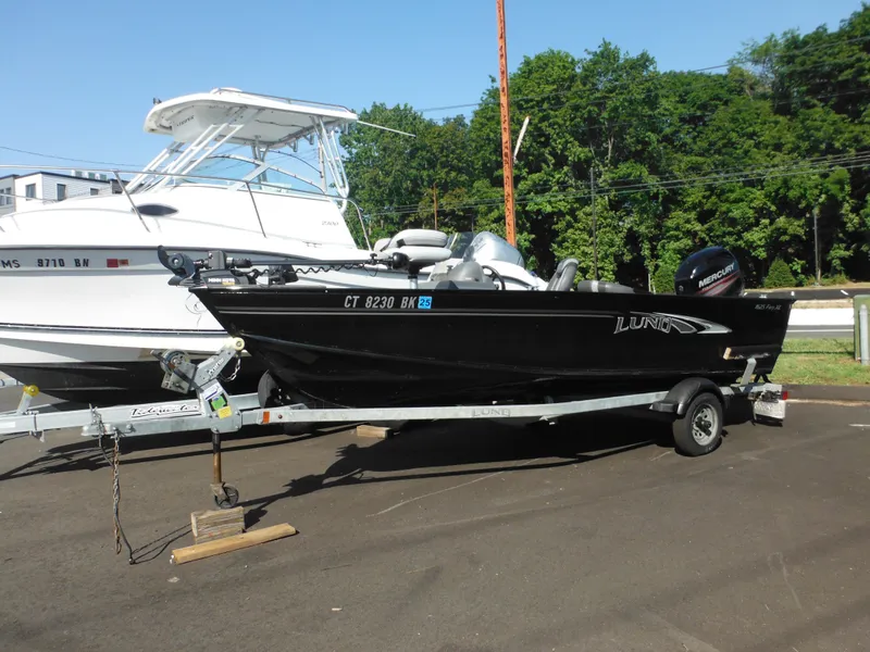 Slide: The Image of 2018 Lund 1625 Fury XL SS boat on a trailer, parked outdoors. - 42
