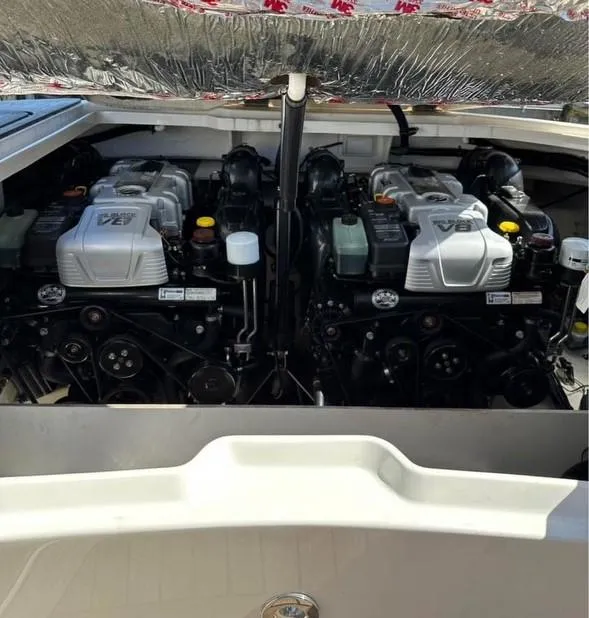 Slide: The Image of 2014 Sea Ray 350 SLX boat engine compartment with dual V8 engines. - 18
