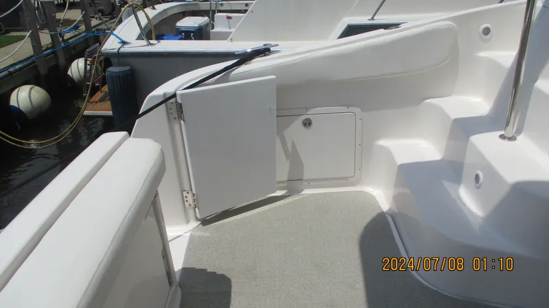 Slide: The Image of 2007 Regal 4080 Sportyacht deck area with open storage compartments. - 12